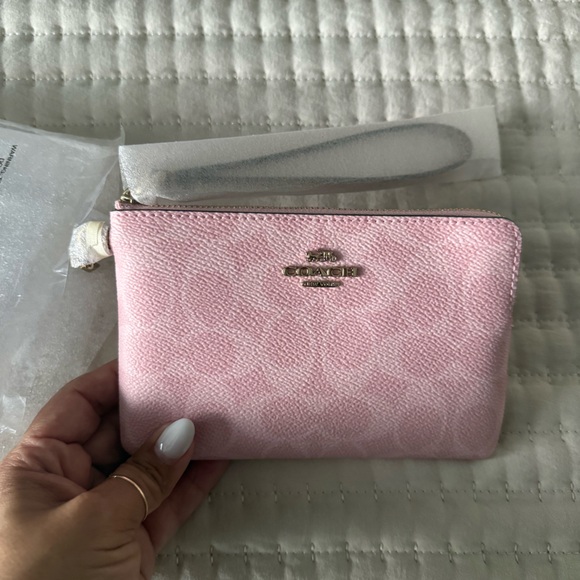 Coach Handbags - Coach Powder Pink Zip-Around Wristlet